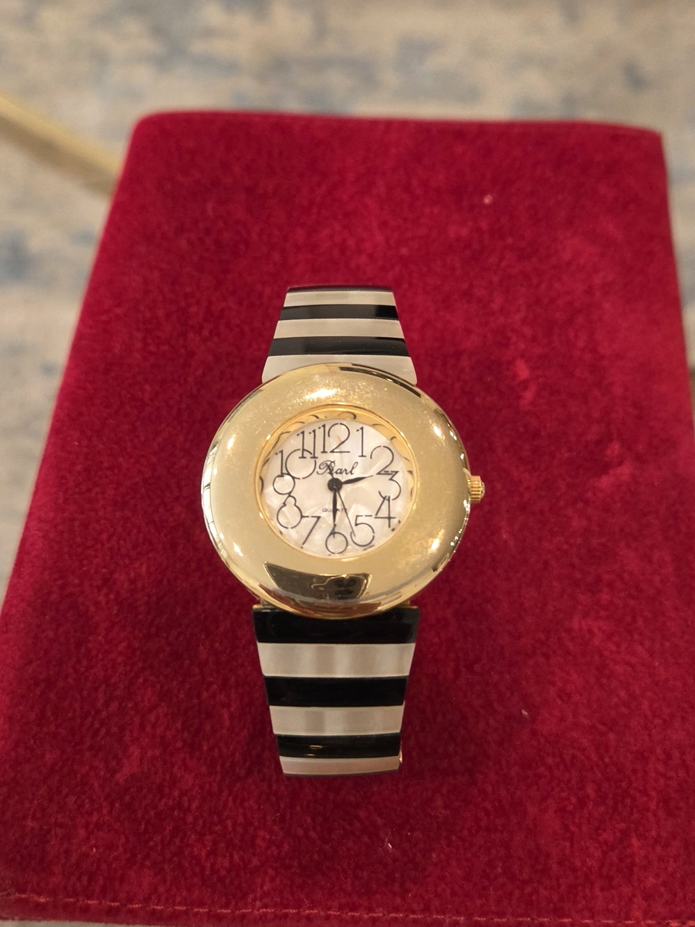 Vintage Pearl Gold-Tone Watch with Black and White Striped Band